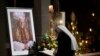 A person signs a book of condolence for Pope Emeritus Benedict XVI at the Saint Magdalena church in Altoetting, Germany, Dec. 31, 2022. 