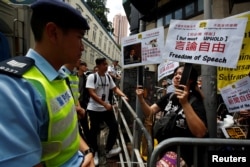 FILE - Protesters supporting freedom of speech demonstrate near the Foreign Correspondents' Club in Hong Kong, China, Aug. 14, 2018.