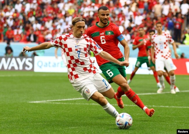 Croatia's Lovro Majer in action with Morocco's Romain Saiss during the Morocco v Croatia World Cup match at Al Bayt Stadium, Al Khor, Qatar, Nov. 23, 2022.