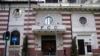 FILE - People walk past the Hong Kong Foreign Correspondents' Club in Hong Kong, Nov. 5, 2021. 