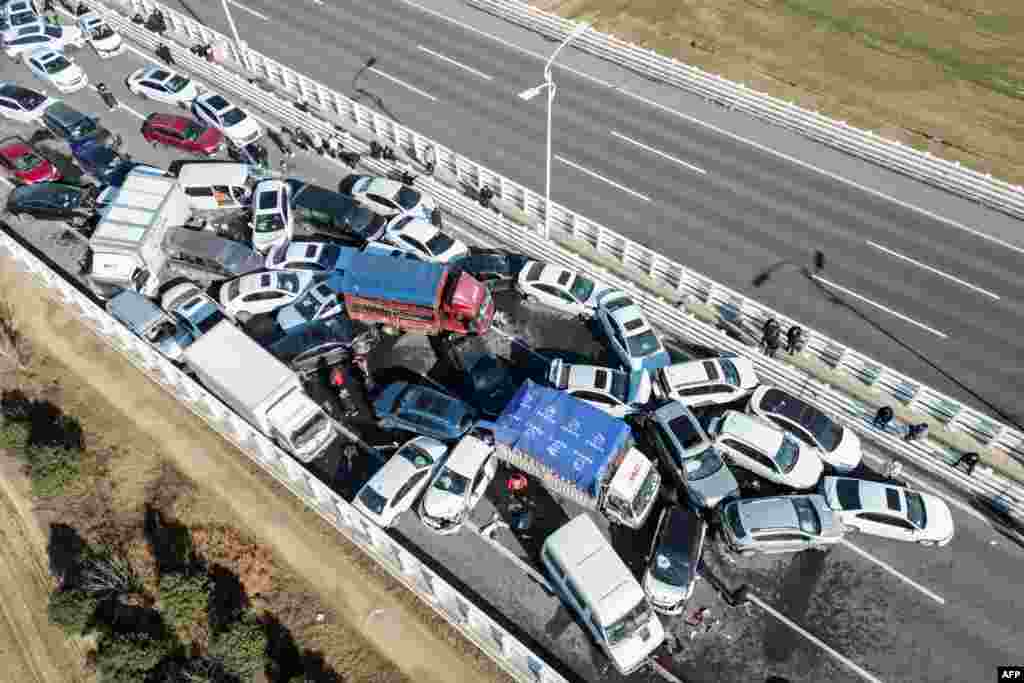 This aerial photo shows a multi-vehicle collision on Zhengxin Yellow River Bridge in Zhengzhou, in China's central Henan province, Dec. 28, 2022. 