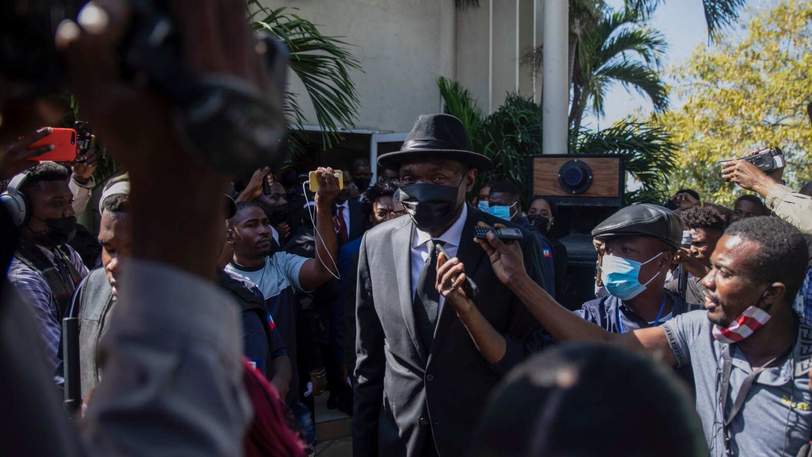 FILE - Haiti Senate President Joseph Lambert, center, arrives for a press conference at the Senate chambers, in Port-au-Prince, Jan. 10, 2022.
