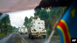 FILE - UN vehicles patrol the road leading to the front line in Goma, Democratic Republic of the Congo, Nov. 25, 2022.