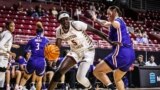 FILE - Boston Eagle Maria Gakdeng, 19, driving past a UMass Lowell defender, Boston, Massachusetts, Nov. 7, 2022.