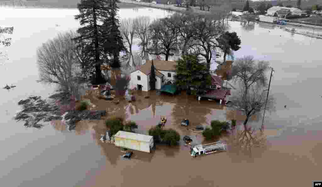 This aerial view shows a flooded home partially underwater in Gilroy, Jan. 9, 2023.