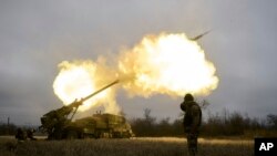 Ukrainian soldiers fire a French-made CAESAR self-propelled howitzer towards Russian positions near Avdiivka, Donetsk region, Dec. 26, 2022. 