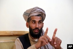 Masih Rahman speaks during an interview with the Associated Press in Kabul, Afghanistan, April 23, 2019. In September last year Masih Rahman's entire family of 11 people, his wife, four daughters, three sons and four nephews, were killed when a bomb flattened their home in central Maidan Wardak province..