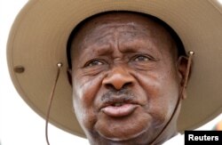 FILE - Uganda's President Yoweri Museveni talks to reporters in Rushere, Kiruhura district, west of Kampala, Feb. 18, 2011.