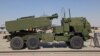 FILE - A US M142 HIMARS rocket launcher is parked on the tarmac at the 2021 Dubai Airshow in the Gulf emirate, Nov. 15, 2021. 