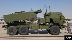 FILE - A US M142 HIMARS rocket launcher is parked on the tarmac at the 2021 Dubai Airshow in the Gulf emirate, Nov. 15, 2021. 