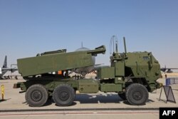 FILE - A US M142 HIMARS rocket launcher is parked on the tarmac at the 2021 Dubai Airshow in the Gulf emirate, Nov. 15, 2021.