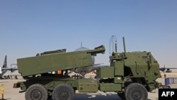 FILE - A US M142 HIMARS rocket launcher is parked on the tarmac at the 2021 Dubai Airshow in the Gulf emirate, Nov. 15, 2021. 