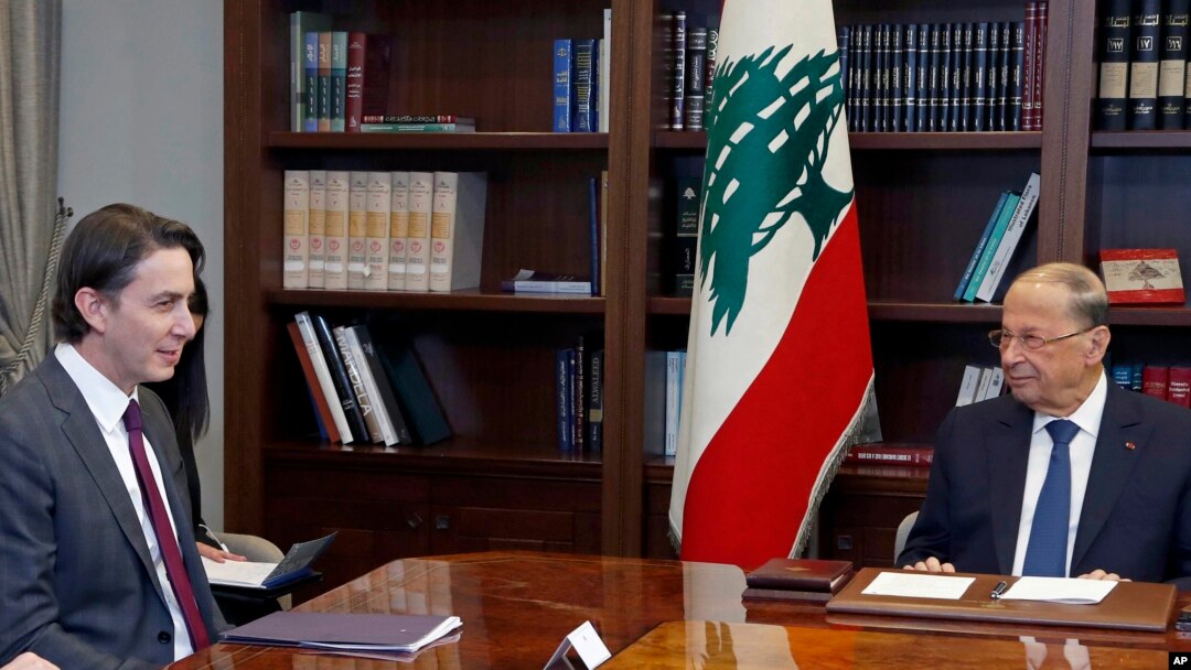 FILE - Lebanese President Michel Aoun, right, with U.S. Envoy for Energy Affairs Amos Hochstein, left, in Beirut, Lebanon, Feb. 9, 2022.