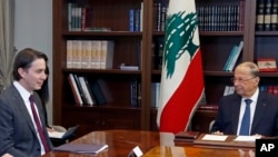 FILE - Lebanese President Michel Aoun, right, with U.S. Envoy for Energy Affairs Amos Hochstein, left, in Beirut, Lebanon, Feb. 9, 2022.