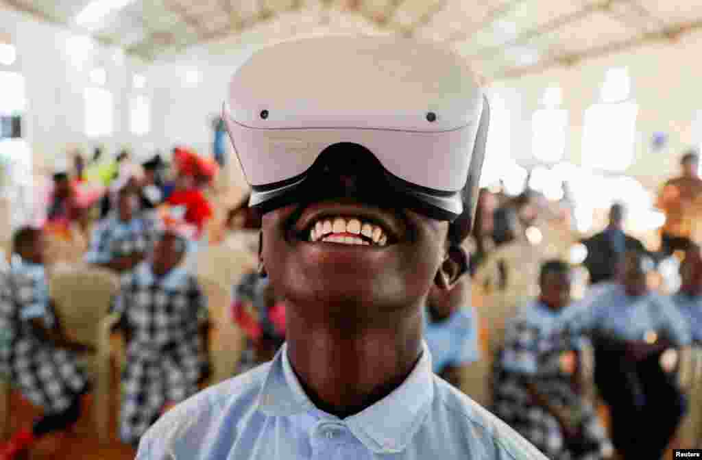 Francis Mwangi, 13, uses an Oculus virtual reality (VR) headset, to virtually visit Buckingham Palace during the celebration of Britain&#39;s Queen Elizabeth&#39;s Platinum Jubilee, in Nyeri, Kenya.