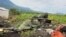 FILE - DRC soldiers take their position following renewed fighting near Congo's border with Rwanda, outside Goma in the DRC's North Kivu province, May 28, 2022. U.N. experts claim that the M23 rebel group has had support in the region from Rwandan troops.