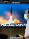 FILE: A TV screen showing a news program reporting about Sunday's North Korean missile launch with file image, is seen at a train station in Seoul, South Korea, June 5, 2022. 