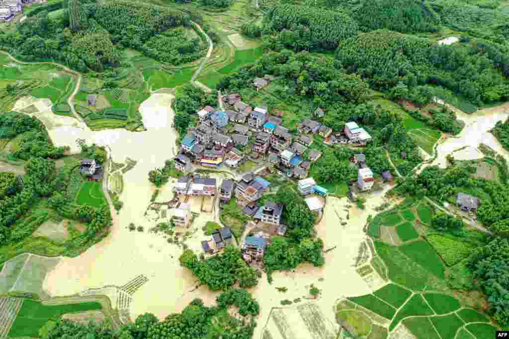 This aerial photo shows flooded fields and buildings following heavy rains in Rongan in China&#39;s southern Guangxi region.
