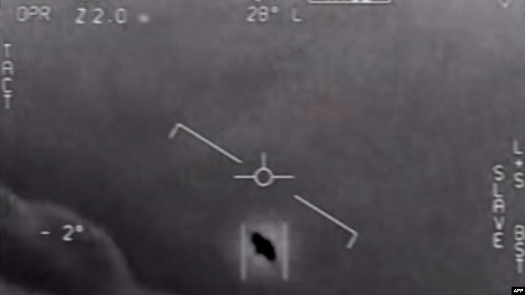 FILE - In this photo taken on April 28, 2020 this video grab image courtesy of the US Department of Defense shows part of an unclassified video taken by Navy pilots that have circulated for years showing interactions with "unidentified aerial phenomena.