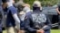 Authorities arrest members of the white supremacist group Patriot Front near an Idaho pride event, June 11, 2022, after they were found packed into the back of a U-Haul truck with riot gear.