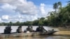 This photo released by the Amazon Military Command shows a rescue team tasked with finding British missing journalist Dom Philipps and Brazilian indigenous expert Bruno Pereira at the Javari river in Acre state, Brazil, June 8, 2022.