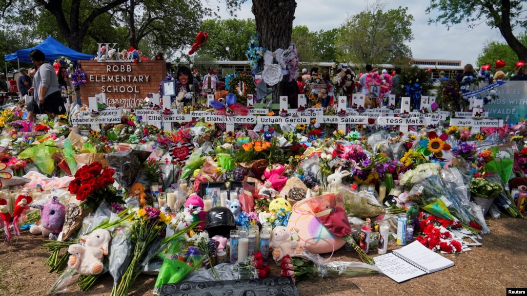 FILE PHOTO: Flowers, toys, and other objects to remember the victims of the deadliest U.S. school mass shooting in nearly a decade, resulting in the death of 19 children and two teachers, are pictured at the Robb Elementary School in Uvalde, Texas.