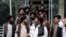 FILE - Mullah Abdul Ghani Baradar, acting deputy prime minister of the Afghan Taliban's caretaker government, center, and other Taliban officials attend a ceremony marking the 9th anniversary of the death of Mullah Mohammad Omar, Apr. 24, 2022.