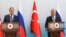Russian Foreign Minister Sergey Lavrov, left, and Turkish Foreign Minister Mevlut Cavusoglu talk to journalists during a joint news conference in Ankara, Turkey, June 8, 2022. 