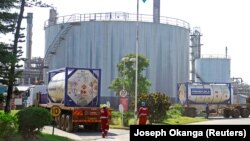 FILE: Tanker trucks carry crude oil during a pilot scheme to export crude oil, as they arrive at the Kenya Pipeline Company in the port city of Mombasa, Kenya. Taken June 7, 2018.