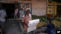 A man carries a sack of wheat flour imported from Turkey in the Hamar-Weyne market in the capital Mogadishu, Somalia, May 26, 2022.