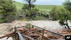 This photo provided by the National Park Service, shows a washed out bridge from flooding at Rescue Creek in Yellowstone National Park, Montana, on June 13, 2022.