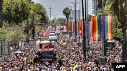 Participants march during the annual Pride Parade in Israel's Mediterranean coastal city of Tel Aviv.