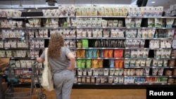A person shops in a supermarket in Manhattan, New York City, as inflation affected consumer prices, June 10, 2022. 