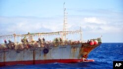 FILE - The Chinese squid fishing vessel Fu Yuan Yu 7880 sails on the Pacific Ocean on July 18, 2021. 