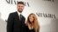  La chanteuse Shakira et le joueur du FC Barcelone Gerard Piqué posent pour une photo le 20 mars 2014.
