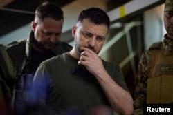 Ukraine's President Volodymyr Zelenskiy visits a position of Ukrainian service members, as Russia's attack on Ukraine continues, in Soledar, Donetsk region, Ukraine June 5, 2022. Photo Credit: Ukrainian Presidential Press Service/Handout via Reuters.