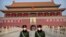 FILE: In this Jan. 27, 2020, file photo, paramilitary police wear face masks as they stand guard at Tiananmen Gate adjacent to Tiananmen Square in Beijing.