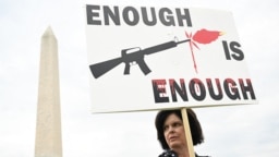 A gun control advocate participates in the "March for Our Lives" rally against gun violence, near the Washington Monument on the National Mall in Washington, June 11, 2022.