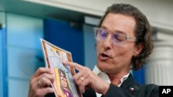Actor Matthew McConaughey holds a picture made by Alithia Ramirez, 10, who was killed in the mass shooting at an elementary school in Uvalde, Texas, as he speaks during a press briefing at the White House, June 7, 2022, in Washington.