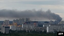 This photograph taken on June 5, 2022 shows smoke after several explosions hit the Ukrainian capital Kyiv early morning. 