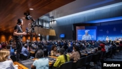 FILE - A general view of the room during the speech of Director-General of the World Trade Organization (WTO) Ngozi Okonjo-Iweala at the opening of the 12th Ministerial Conference, at WTO headquarters in Geneva, Switzerland, June 12, 2022.