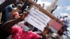 Supporters participate in a demonstration called by Mali's transitional government after ECOWAS (Economic Community of West African States) imposed sanctions in Bamako, Mali, Jan. 14, 2022. 