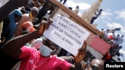 Supporters participate in a demonstration called by Mali's transitional government after ECOWAS (Economic Community of West African States) imposed sanctions in Bamako, Mali, Jan. 14, 2022. 