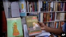 A book seller shows books on Aurangzeb in New Delhi, Thursday, June 2, 2022. For more than three centuries, Mughal emperor Aurangzeb remained relegated to India's history books.