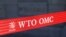 FILE:: A logo is pictured outside the World Trade Organization (WTO) building in Geneva, Switzerland, April 1, 2021.TRADE-WTO/