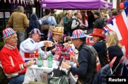 Revelers attend a Jubilee-themed community street lunch as the Queen's Platinum Jubilee celebrations continue in Cookham, Britain, June 5, 2022.