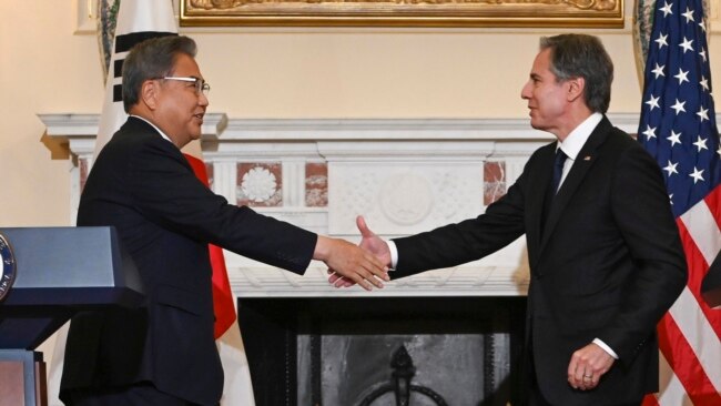 Secretary of State, Antony Blinken shakes hands with South Korean Foreign Minister Park Jin at the State Department in Washington, June 13, 2022, after a news conference.
