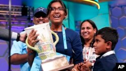 Harini Logan, 14, from San Antonio, Texas, celebrates winning the Scripps National Spelling Bee with her family on June 2, 2022, in Oxon Hill, Md. June 2, 2022. (AP Photo/Alex Brandon)