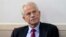 FILE - White House trade adviser Peter Navarro listens as President Donald Trump speaks during a news conference at the White House, on August 14, 2020, in Washington. Navarro was indicted, June 3, 2022, on contempt charges after defying a subpoena from t
