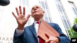 Former Trump White House official Peter Navarro speaks to reporters June 3, 2022, outside of federal court in Washington.